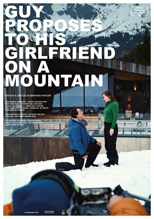 Постер Guy proposes to his girlfriend on a mountain